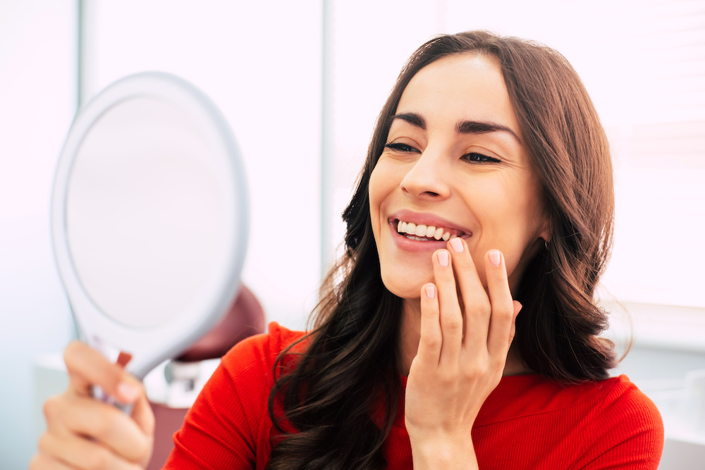 woman smiling in mirror