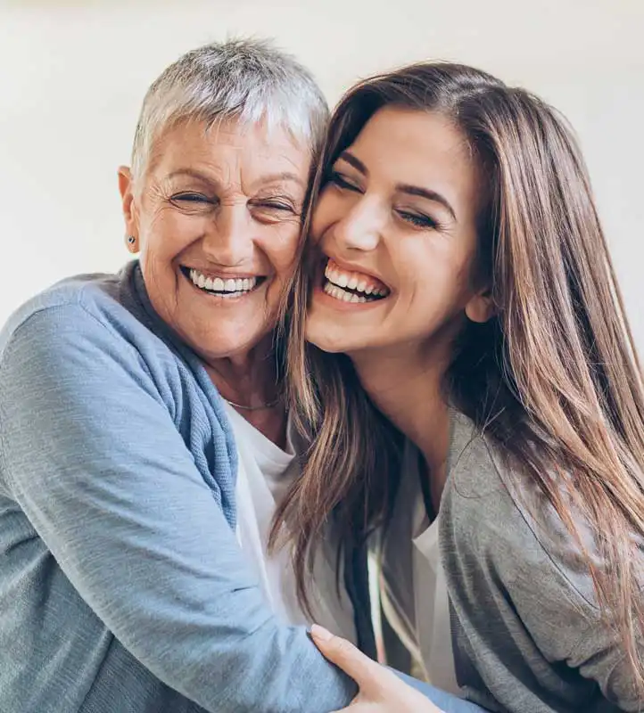 smiling grandmother and daughter