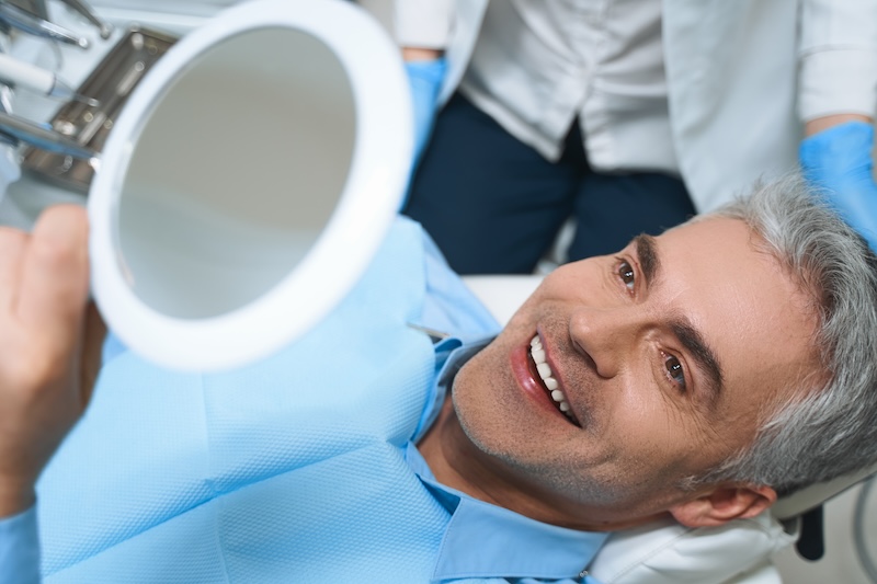man showing a smile after a dental treatment